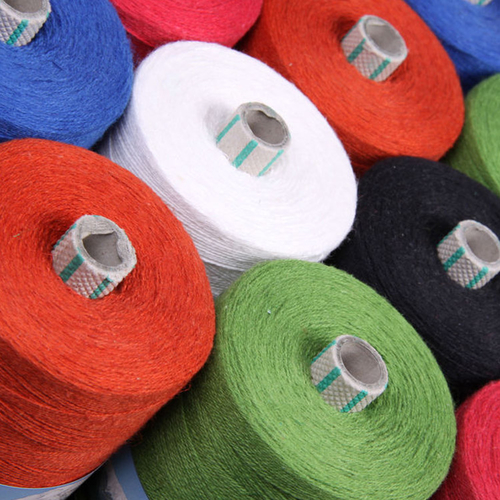 What materials are commonly used to make carpet yarn